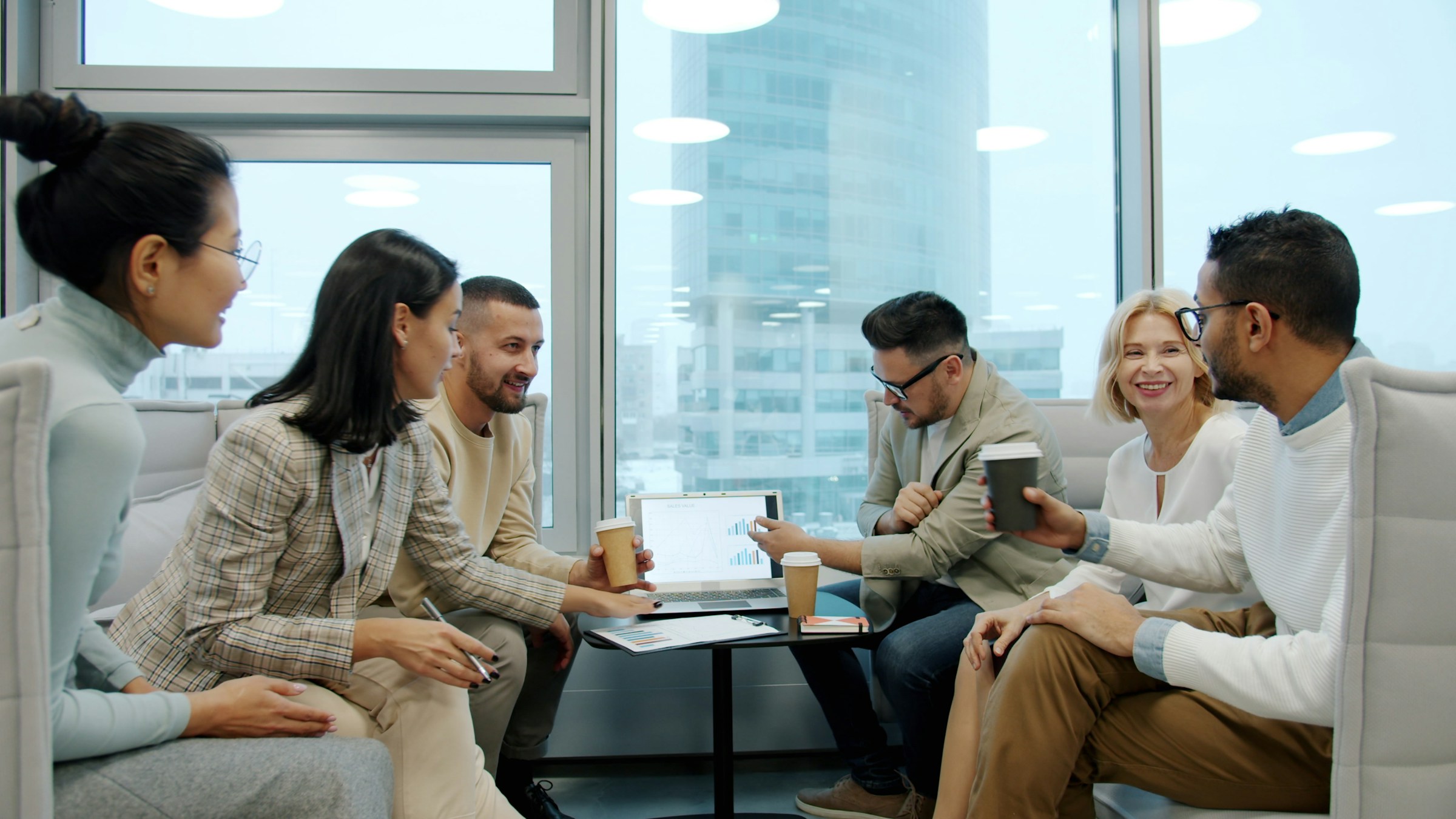 Diverse business professionals collaborating in a modern office meeting